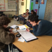 Algebra students work together to solve math problems!
